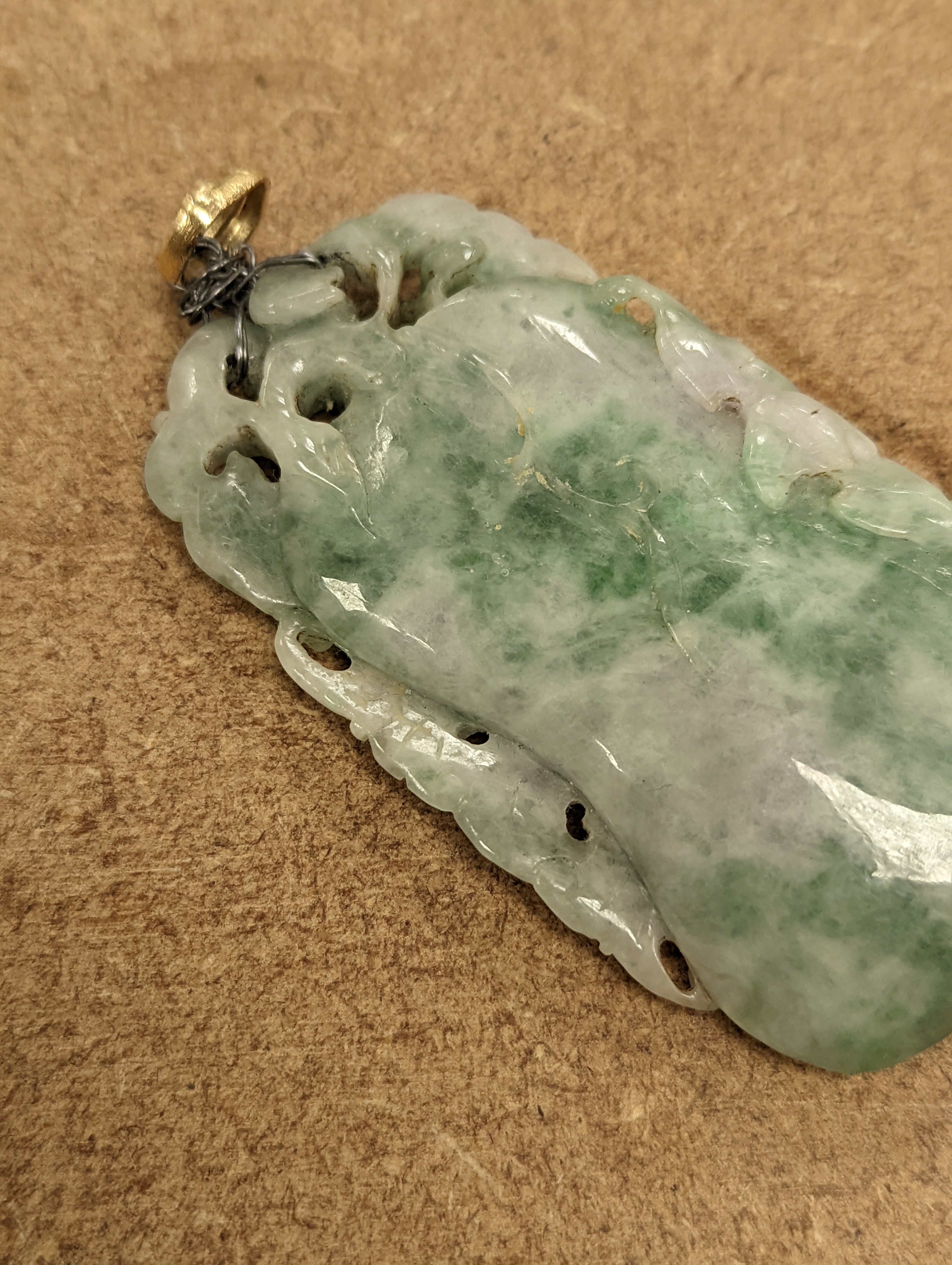 A Chinese mottled jadeite plaque 8cm